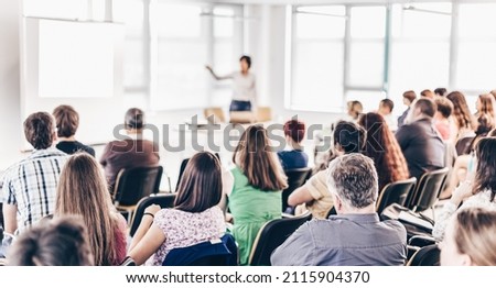 Speaker giving presentation on business conference. Royalty-Free Stock Photo #2115904370