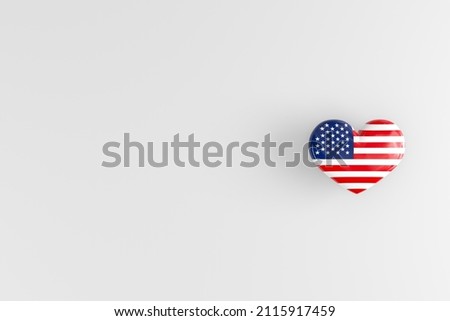 The US flag on a heart-shaped badge as a symbol of patriotism and love for one's homeland. Glossy badge with US state symbols. copy space