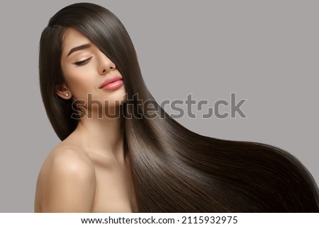 Fashion woman with straight long shiny hair. Beauty and hair care Royalty-Free Stock Photo #2115932975