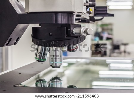 microscope isolated under the white background Royalty-Free Stock Photo #211596403