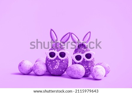 Colorful Easter egg with bunny ears and sunglasses on a violet background. Sale banner, mockup template. With copy space