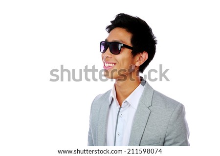 Portrait of a smiling asian man in sunglasses over white background