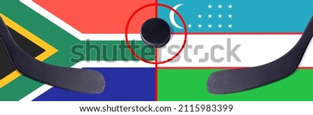 Top view hockey puck with South Africa vs. Uzbekistan command with the sticks on the flag. Concept hockey competitions