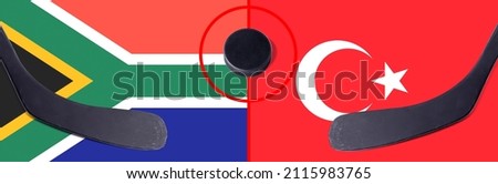 Top view hockey puck with South Africa vs. Turkey command with the sticks on the flag. Concept hockey competitions