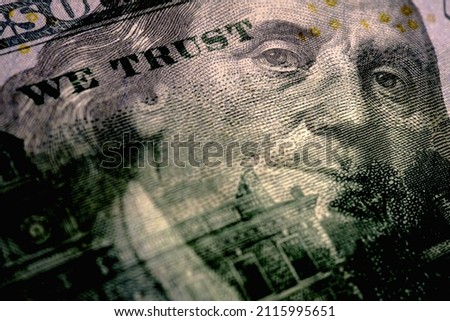 American paper money. A 100 dollar bill with a portrait of Benjamin Franklin in focus. US banknotes closeup. Public debt and USA dollar. Reserve or anchor currency. Macro Royalty-Free Stock Photo #2115995651