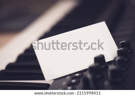 Mockup of a business card that sticks out in a synthesizer or midi keyboard