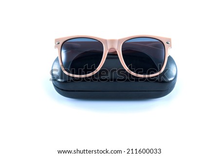 pink sunglasses in black opened case on white background 