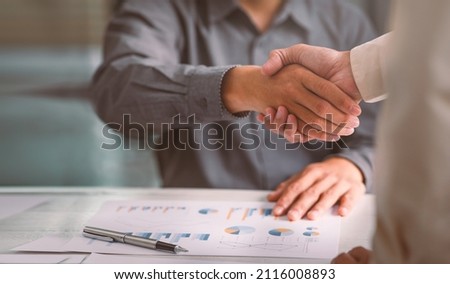 Business handshake for teamwork of business merger and acquisition,successful negotiate,hand shake,two businessman shake hand with partner to celebration partnership and business deal concept Royalty-Free Stock Photo #2116008893