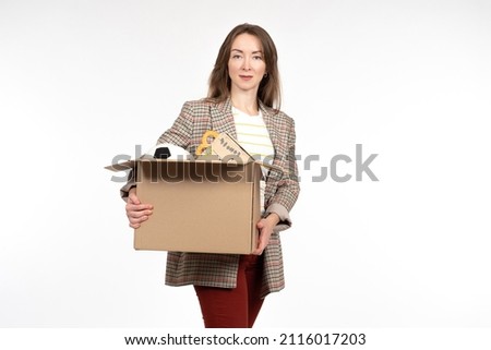 Woman thinks about place to store things. Items in open box. Concept of unnecessary personal belongings in hands of girl. Woman with boxes on white. Girl needs place for personal storage.