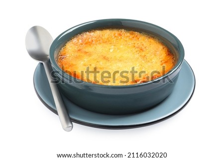 Delicious creme brulee in ceramic ramekin with spoon isolated on white Royalty-Free Stock Photo #2116032020