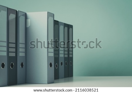 Set of ring binders in the archive, one is not aligned, data access concept, blank copy space Royalty-Free Stock Photo #2116038521