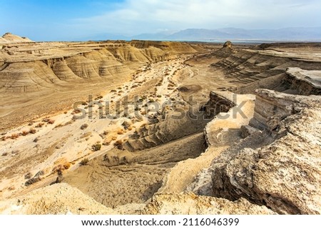 The Judean Desert. Ancient mountains and deserts around the Dead Sea. Israel. Interesting walk among picturesque hills, cliffs and gorges. Magnificent exotic resort for treatment.  Royalty-Free Stock Photo #2116046399