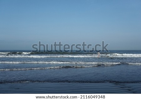 Sand, beach and waves in the morning can be used as a background. Kuta Beach, Bali.              