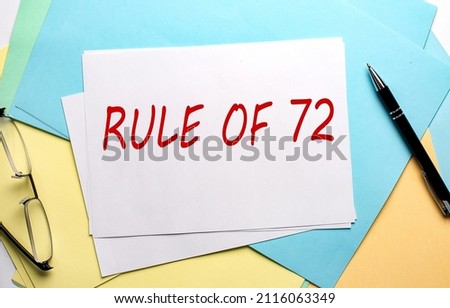 RULE OF 72 text on paper on colorful paper background Royalty-Free Stock Photo #2116063349