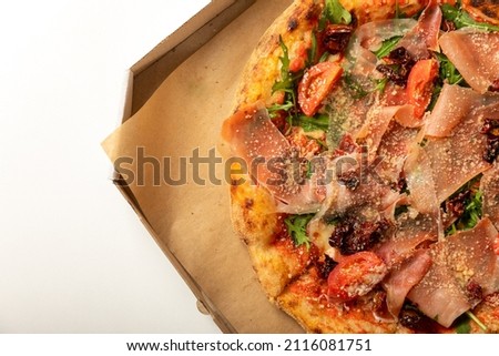 Banner
close-up of Delicious pizza in a box on a white background. Top view of hot pizza. With copy space for text.