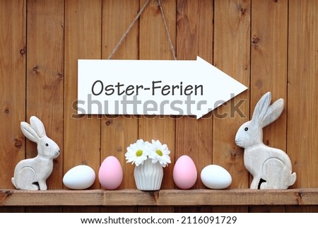 Easter decoration with the text Easter holidays, means translated osterferien.