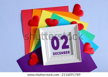 day of the month 02 December calendar    Calendar date in a white frame on a rainbow background.