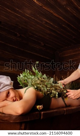 a girl takes a steam bath with a bath attendant