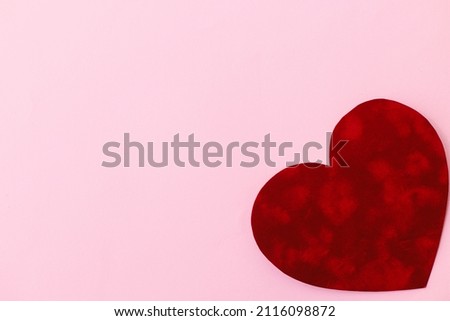 Happy Valentine's Day! Stylish valentine heart on pink background flat lay with space for text. Valentines day card template. Cute red velvet heart on pink paper. Love concept