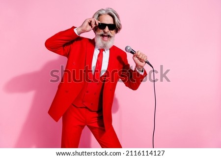 Portrait of attractive trendy talented cheery grey-haired man mc showman singing hit isolated over pink pastel color background Royalty-Free Stock Photo #2116114127