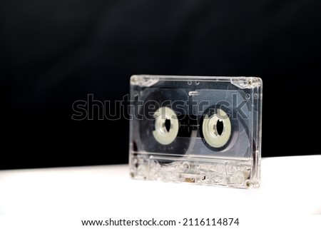Vintage Audio Cassettes Rotate on Black and White Background.