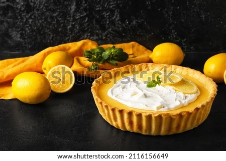 Delicious lemon tart on dark background