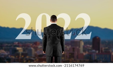 New year concept of 2022. New year's card. Prospect of business with a man