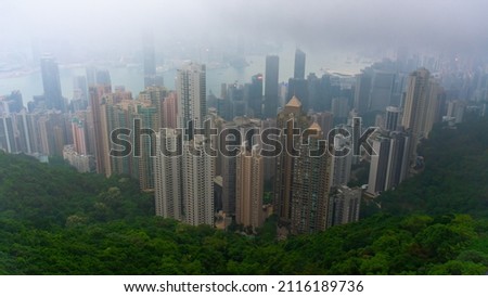 Beautiful view of Victoria Harbor, just before the fog settles in. View from Victoria peak of the Hong Kong cityscape.