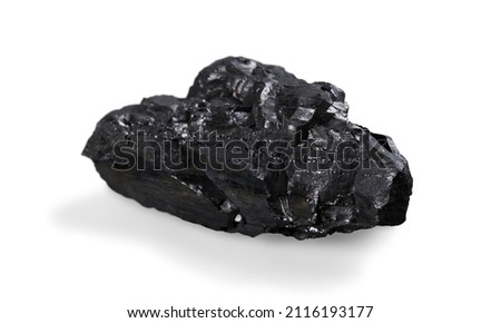 Meteorite black stone rock on background.