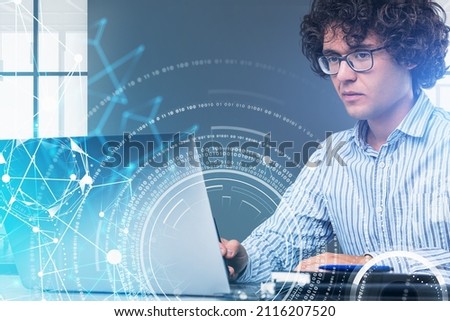 Serious dreaming businessman wearing formal shirt is working on laptop. Office workplace in the background. Digital interface with binary code. Concept of modern technologies in business field
