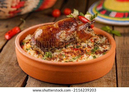 Arabic Cuisine; Egyptian traditional stuffed pigeon or "Hamam Mahshi" dish. Royalty-Free Stock Photo #2116239203