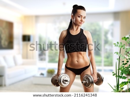 Fitness woman doing exercises for muscle training.