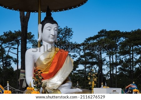 Buddha statue on LanPresrinakarin on top of Phu Kradueng mountain  in Loei City Thailand.Phu Kradueng national park the famous Travel destination