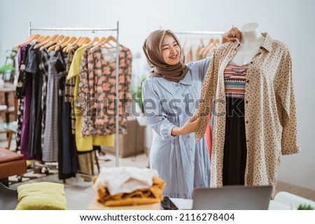 asian muslim designers working in her home office Royalty-Free Stock Photo #2116278404