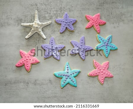 Multicolored star fish sugar cookies with decorated with royal icing.