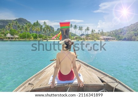 Cute girl is relaxing in the summer at the sea.
Traveling by the sea.Beautiful sea of Thailand.