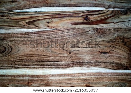 Beautiful wooden background made of cross-cut wood with a pattern of rings. Template for an inscription. Mockup for design. High quality photo Royalty-Free Stock Photo #2116355039