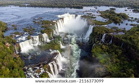 Beautiful aerial view of the Iguassu Falls from a helicopter, one of the Seven Natural Wonders of the World. Foz do Iguaçu, Paraná, Brazil Royalty-Free Stock Photo #2116373099