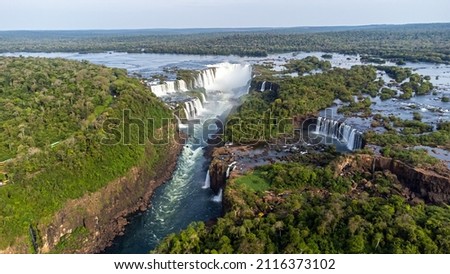 Beautiful aerial view of the Iguassu Falls from a helicopter, one of the Seven Natural Wonders of the World. Foz do Iguaçu, Paraná, Brazil Royalty-Free Stock Photo #2116373102