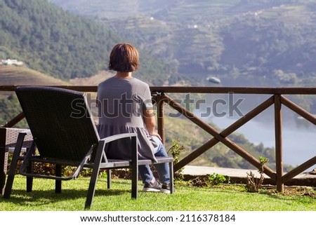 woman looking Vale do Douro valley  in Portugal , Europe , world heritage site , focus in foreground