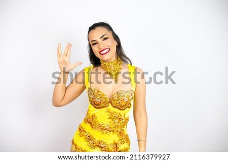 Young beautiful woman wearing carnival costume over isolated white background doing hand symbol