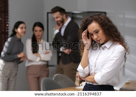 African American woman suffering from racial discrimination at work Royalty-Free Stock Photo #2116394837