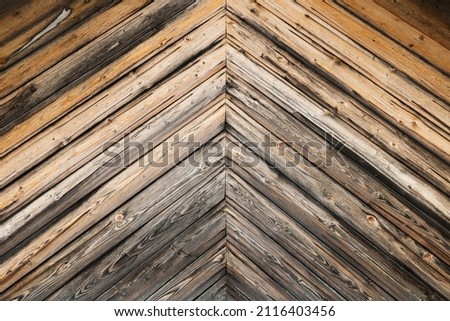 Decorative pattern of an old wooden wall, background photo texture