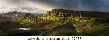 Breathtaking panoramic view taken at The Quiraing on the Isle of Skye, Scotland, UK. Dramatic Scottish landscapes.  Royalty-Free Stock Photo #2116409237