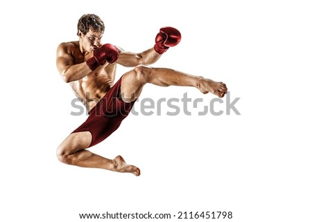 Full size of male athlete kickboxer who perform muay thai martial arts isolated on white background. Sport concept. Red sportswear  Royalty-Free Stock Photo #2116451798