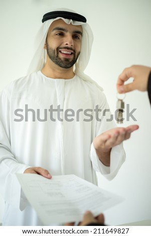 Arabic man making successful deal
