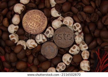 Old vintage coins of India on coffee background