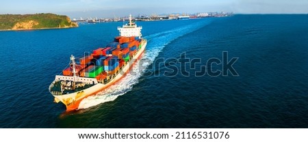 Aerial side view of cargo ship carrying container and running for export  goods  from  cargo yard port to custom ocean concept technology transportation , customs clearance.  forwarder mast