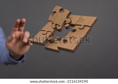 A person presenting a 3D render of puzzles