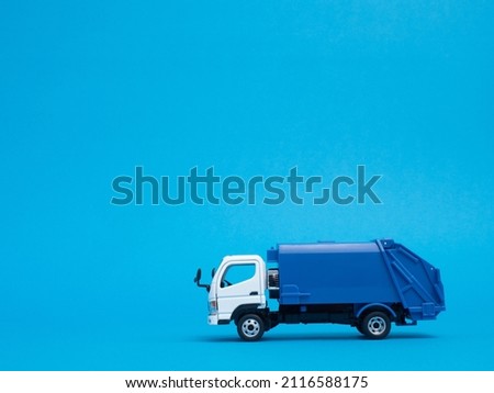 A model of a garbage carrier taken on a blue background